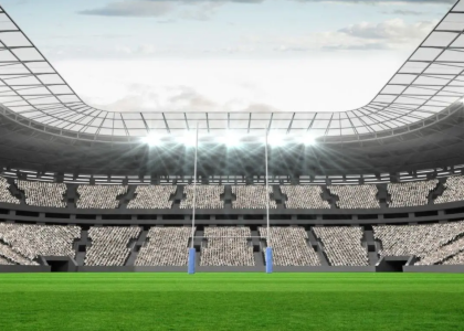 Stadium light shine down on to a football pitch