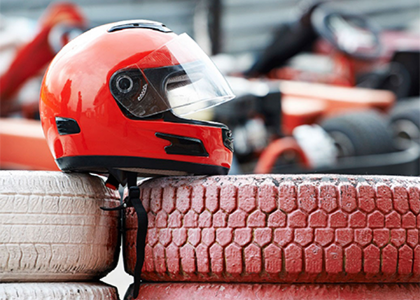 Racing helmet on top of a pile of tires
