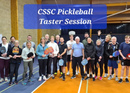 HMRC group of about 20 people holding pickleball rackets