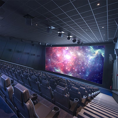 Screen lit cinema viewing room